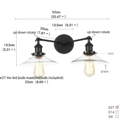 Black iron wall light with two adjustable arms and clear glass shades featuring edison-style bulbs decorbites industrial led