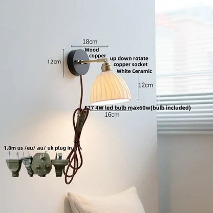 Industrial black wood led wall sconce with brass pull chain featuring a wood and copper base and white ceramic shade