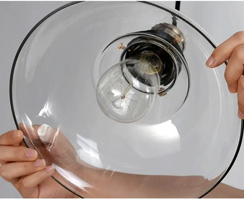 Clear glass pendant light with black rim and exposed filament bulb for industrial brass glass pendant dining room use