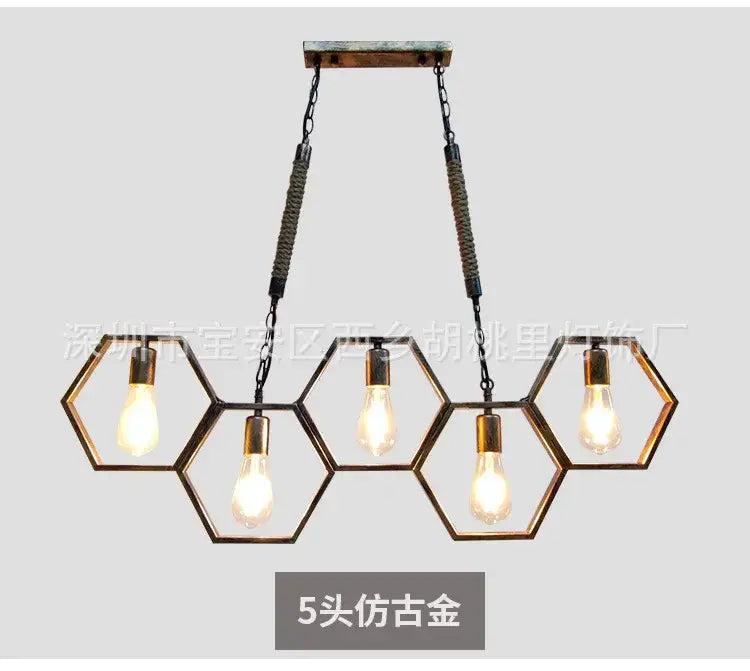 Five-head faux-gold hexagonal pendant light with exposed Edison bulbs and braided chains for industrial style pendant decorbites