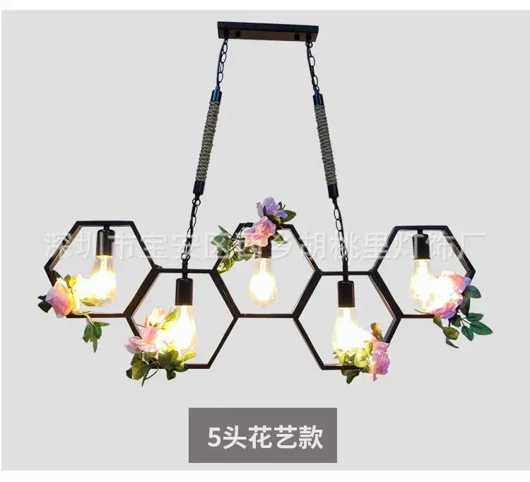 Black industrial brass hexagonal pendant light with five exposed bulbs and floral accents for bar and restaurant decorbites industrial style