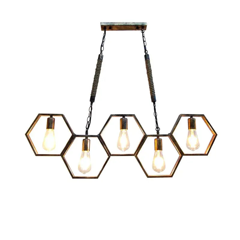 Industrial brass hexagonal pendant light with exposed filament bulbs and metal frames perfect for bar and restaurant decorbites industrial style