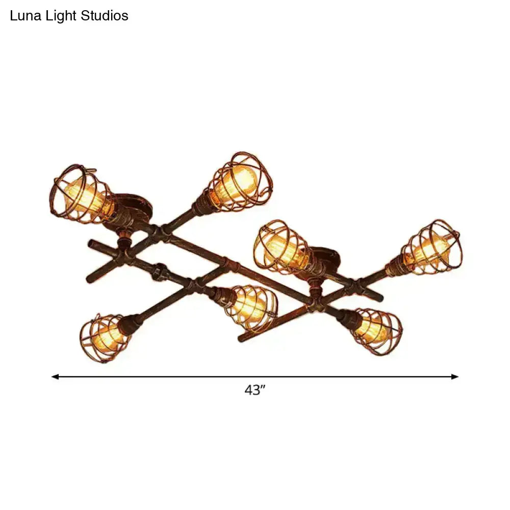 Industrial brass intersecting piping ceiling light with six filament bulbs in dark bronze cage for dining room use