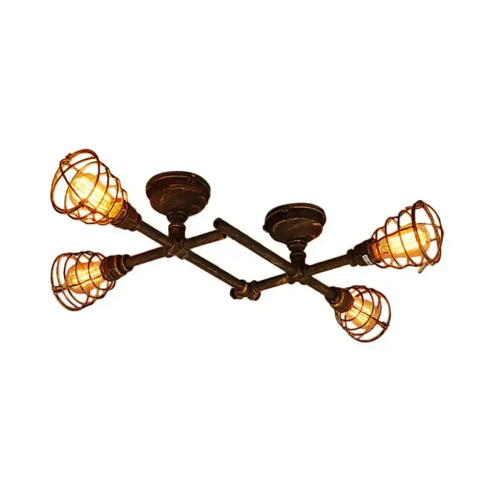 Industrial brass intersecting piping ceiling light with four warm bulbs in wire cages on dark bronze frame for dining room