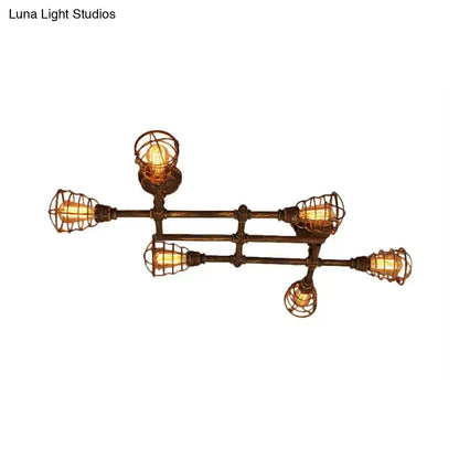 Industrial intersecting piping ceiling light with five exposed filament bulbs in dark bronze metal cage for dining room