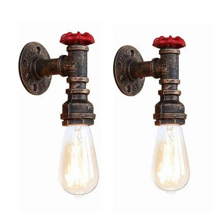 Industrial bronze and black wall lamp with rusted metal pipes and red valve handles featuring clear filament bulbs