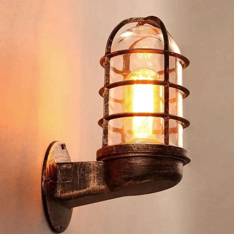 Rustic industrial bronze iron cage guard wall sconce with clear glass dome and exposed edison bulb for bedroom decorbites iron cage