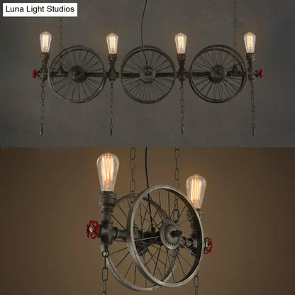 Industrial-style island light featuring bronze metal pipe frame with three vintage wheel design and exposed led incandescent bulbs