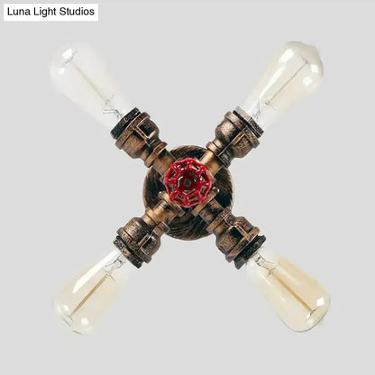 Industrial bronze semi flush foyer light with brass piping, decorative valve bulb base, and four vintage edison bulbs