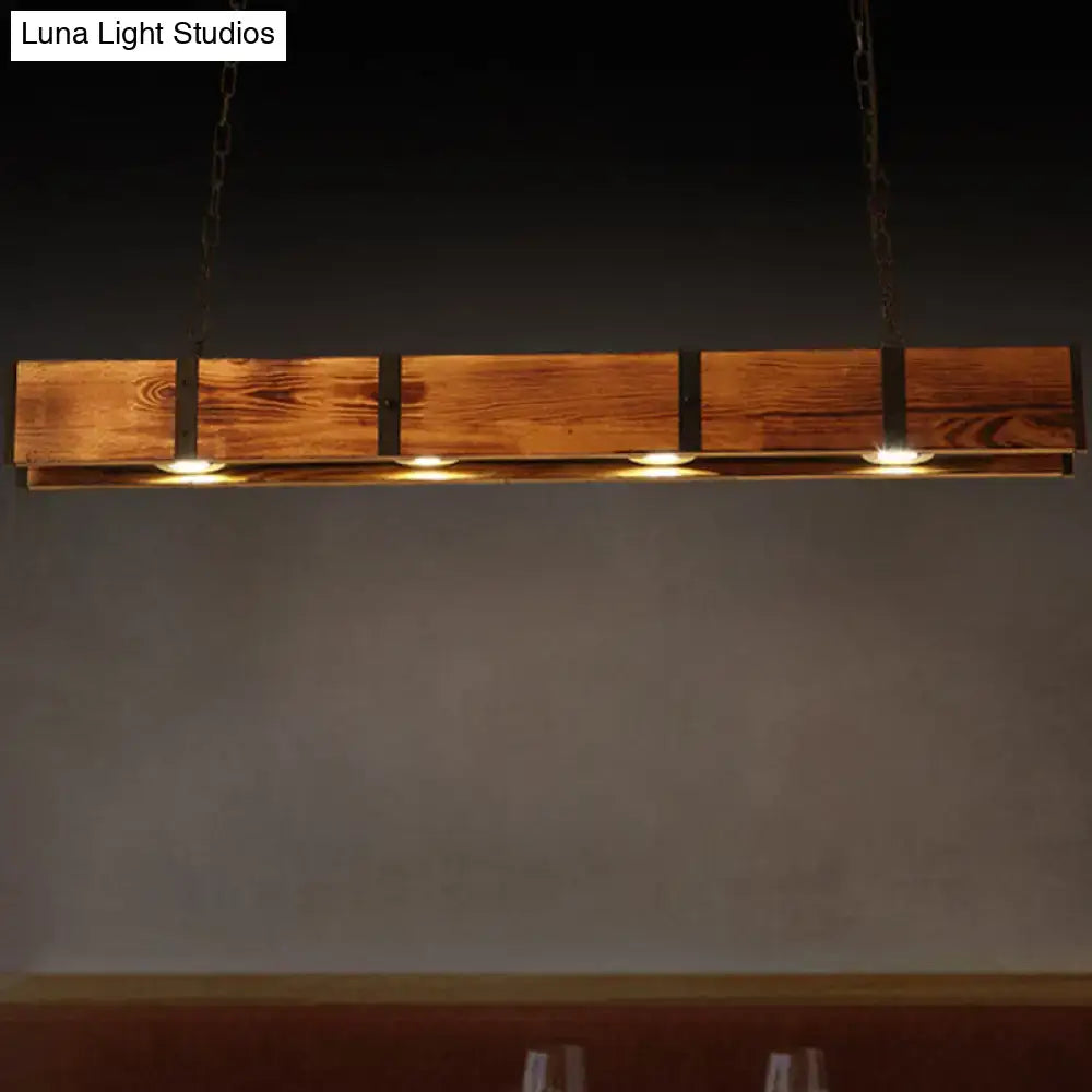 Rustic brown rectangular wooden island ceiling light with black metal accents and four warm-toned bulbs