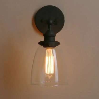 Black metal wall lamp with clear glass shade and exposed filament bulb for industrial decorbites clear glass style