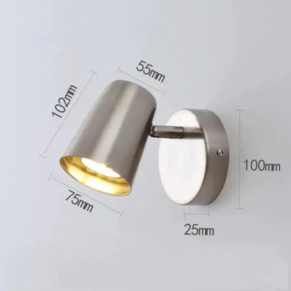 Modern industrial led wall spotlight in brushed nickel with adjustable arm and cylindrical head for bedroom use