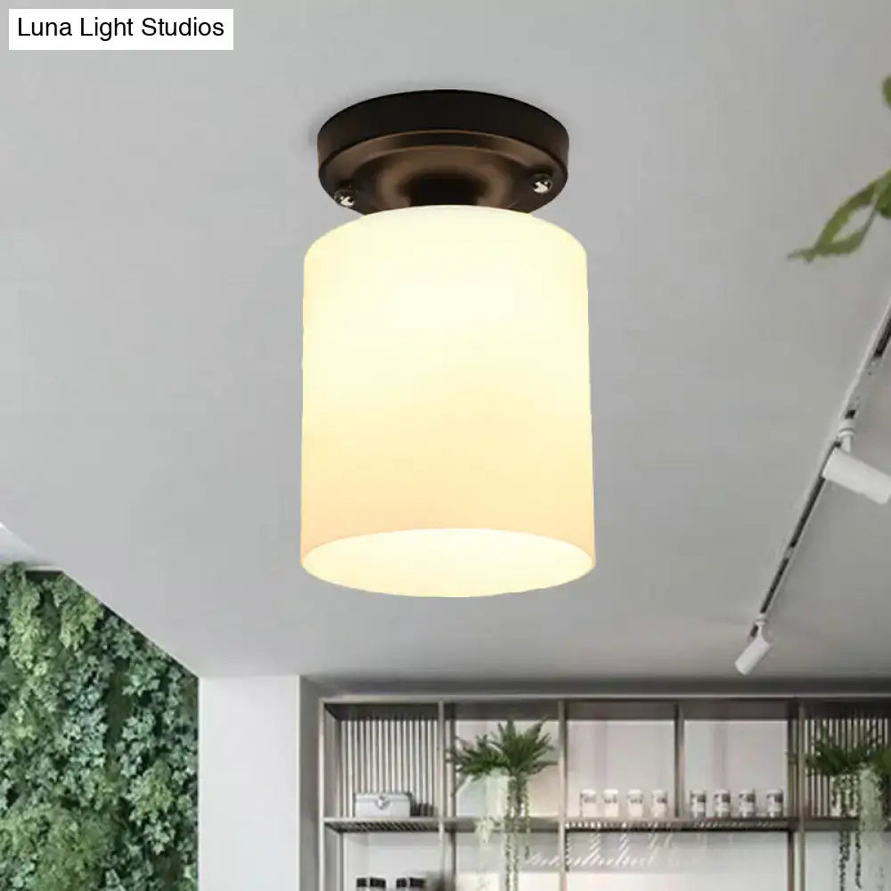 Decorbites black industrial milky glass semi flush light with warm-toned cylindrical glass shade and dark bronze finish ceiling mount
