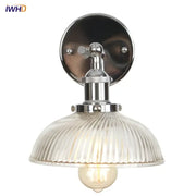 Industrial chrome wall sconce with clear ribbed glass shade and exposed filament bulb for stairway lighting decorbites clear glass