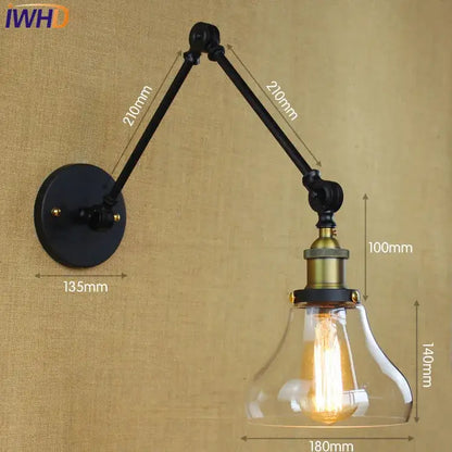 Industrial chrome glass swing arm wall lamp with black and brass adjustable sconce and clear glass bell shade filament bulb