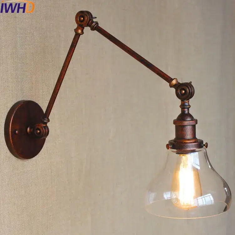 Industrial chrome glass swing arm wall lamp with bronze metal arm and clear shade featuring adjustable glass swing arm