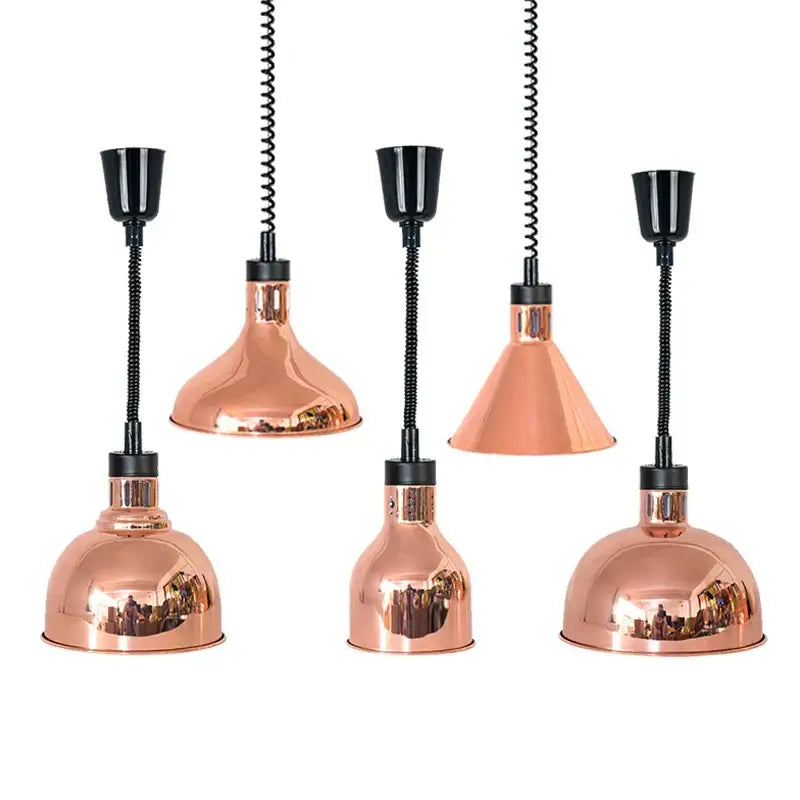 Set of five copper-colored industrial pendant lights with black cords serving as electric heat lamps for dining rooms