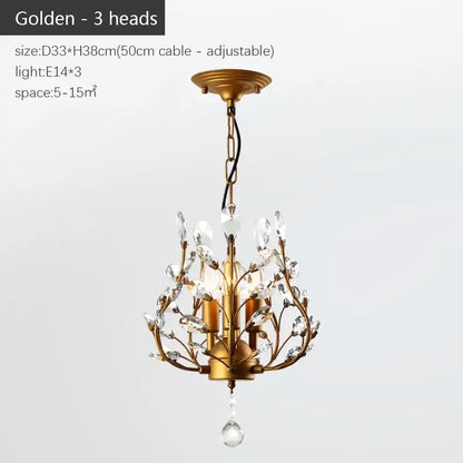Golden industrial crystal chandelier with three ornate arms and teardrop pendant for dining room decor by decorbites industrial
