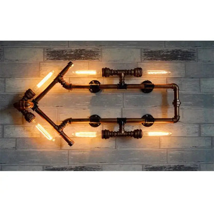Industrial dark brass pipe wall lights featuring four glowing edison bulbs in a geometric pipe wall lights design