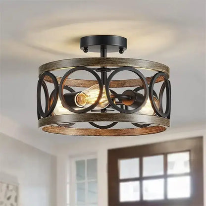 Industrial farmhouse circular chandelier with rustic wood grain frame black metal accents and exposed edison bulbs for dining room decorbites industrial farmhouse
