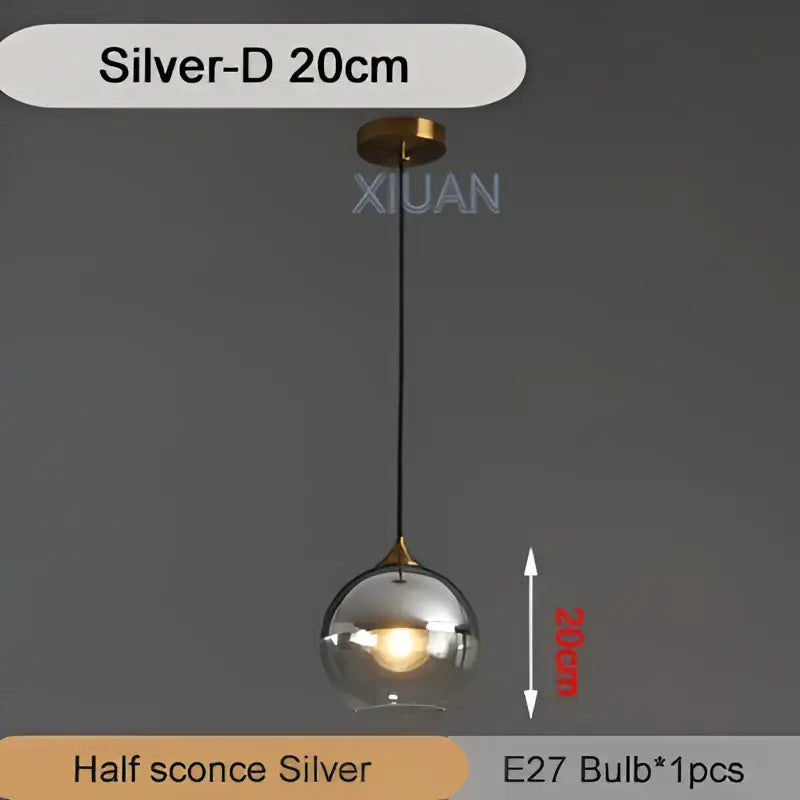 Silver spherical industrial glass pendant light with clear glass globe and brass accents for kitchen dining decorbites industrial glass