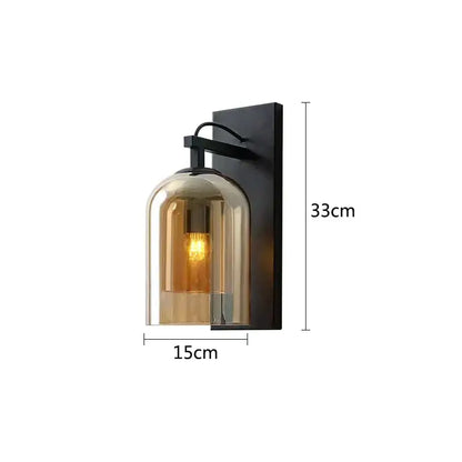 A sleek black metal industrial glass wall lamp with a warm amber clear dome sconce for bedroom decorbites industrial glass