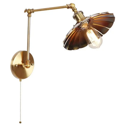 Industrial gold wall lamp with brass finish amber fluted glass shade and pull chain switch for bedroom reading