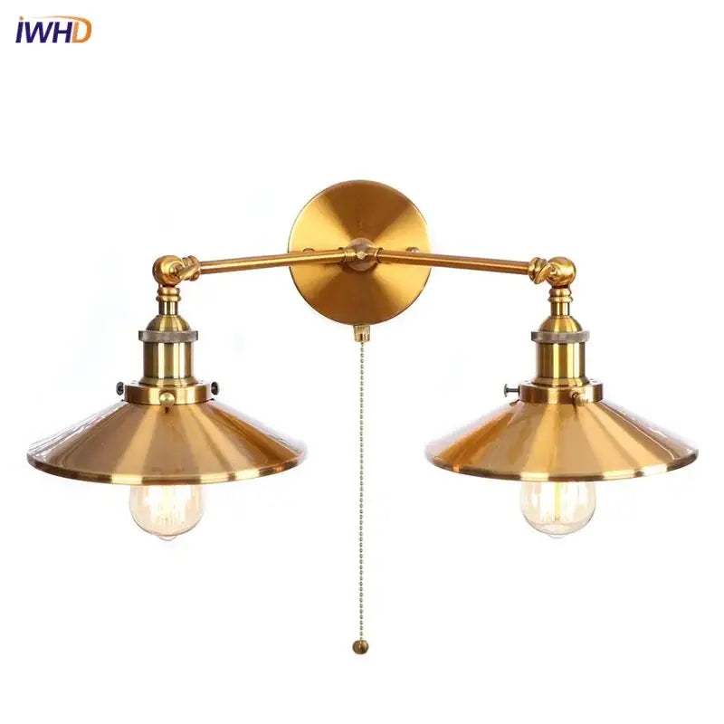 Brass-finished industrial led wall double arm sconce with conical shades and decorbites gold vintage exposed bulbs