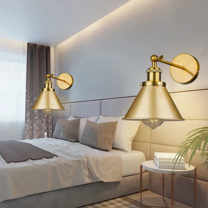 Brass-finished industrial gold wall lamp with conical shades and adjustable arms for decorbites industrial gold wall decor
