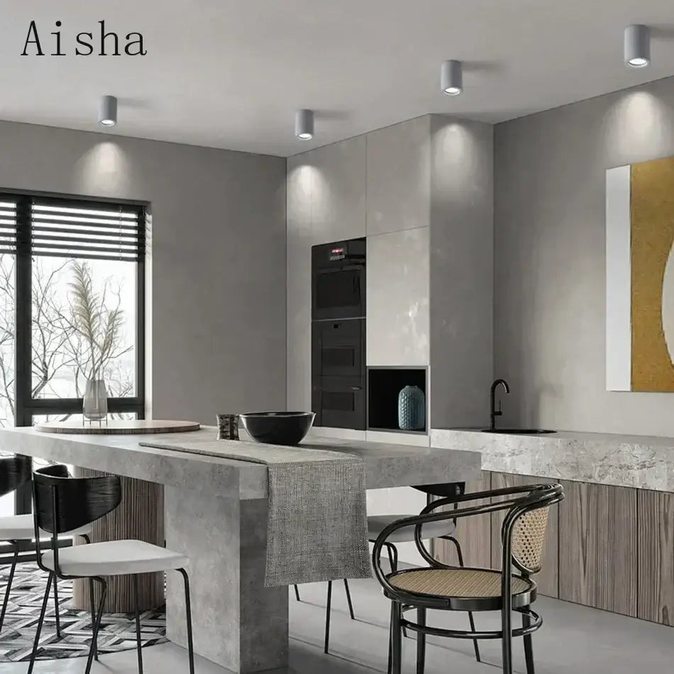 Modern concrete island table with textured gray surface complements decorbites industrial led ceiling light for kitchen decor