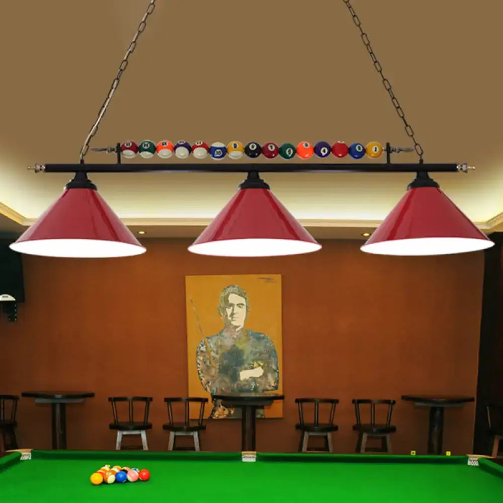 Red conical metal billiard lamp with black frame and colorful balls hanging above pool table country club island light