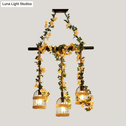 Rustic-style decorbites™ birdcage chandelier with industrial hemp rope and yellow floral vines for restaurant island lighting