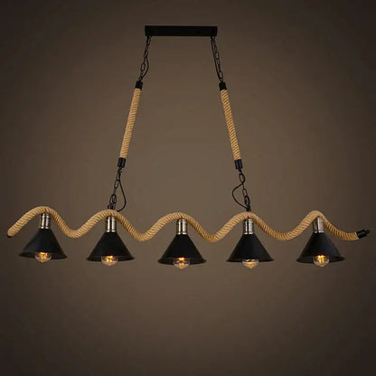 Industrial hemp rope pendant light with four black shades suspended by beige rope and metal chains for kitchen decor