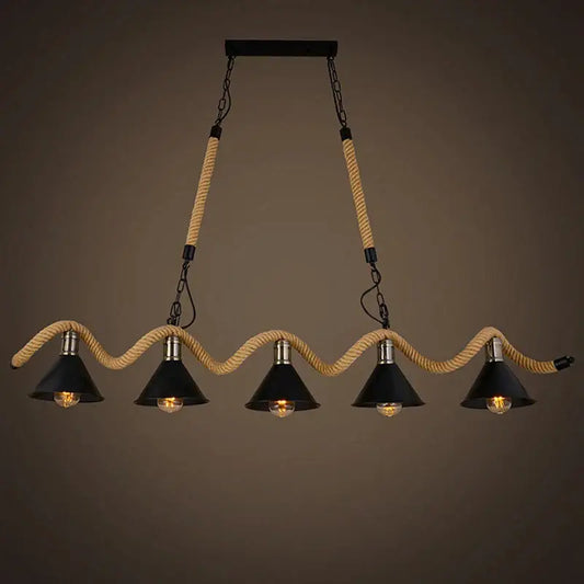 Industrial hemp rope pendant light with four black shades suspended by beige rope and metal chains for kitchen decor