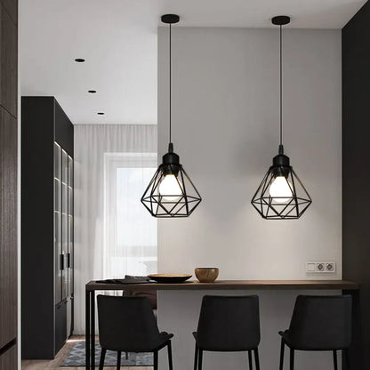 Black iron cage pendant lamp with geometric design hanging above dining table for decorbites industrial iron decor