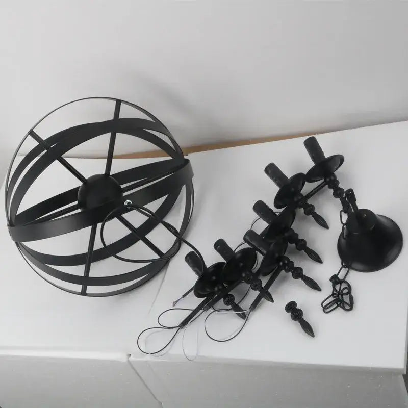 Black metal spherical industrial iron chandelier with candle-style lights and chains decorbites industrial for living room