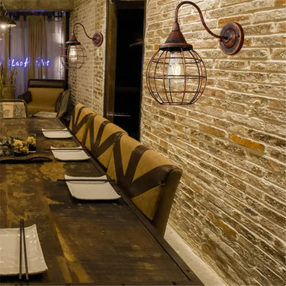 Industrial iron rust wall lights featuring copper-finished metal cage and exposed bulb for living room use