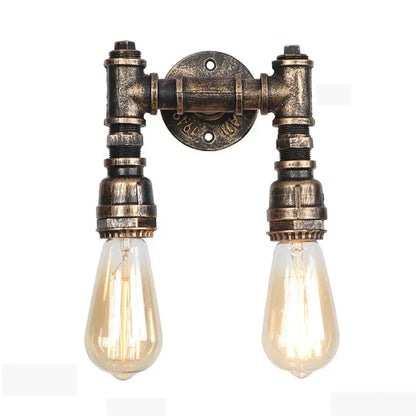 Industrial iron rust wall lights featuring two exposed filament bulbs in brass-finished water pipe fittings for living room