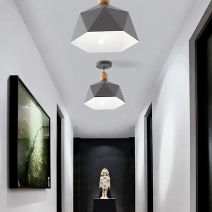 Geometric gray pendant light with wooden accents hanging from ceiling in decorbites industrial loft ceiling kitchen lamp