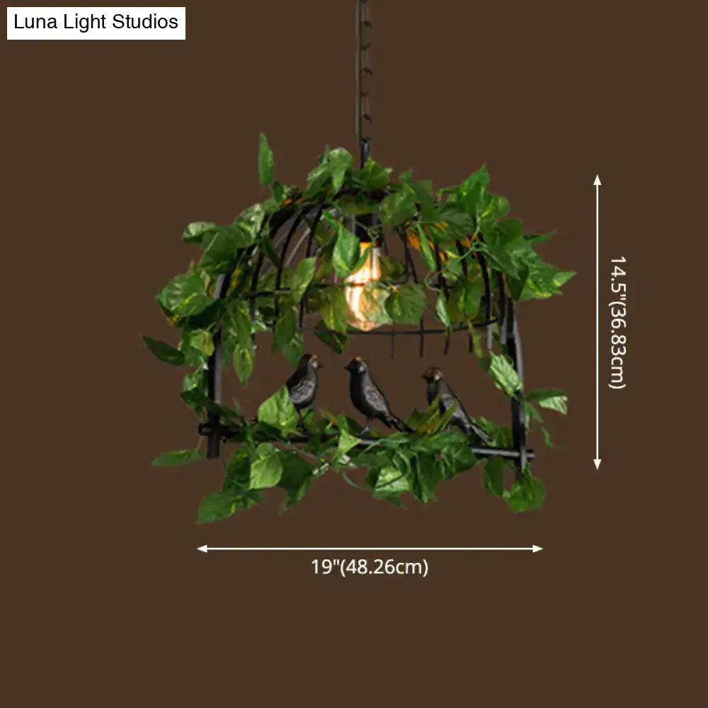 Black industrial metal pendant light by decorbites featuring a birdcage design with artificial vines and exposed filament bulb 220v-240v 110v-120v