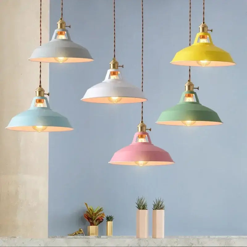 Industrial pastel metal pendant light with brass hardware and exposed bulbs featuring a metal finish shade