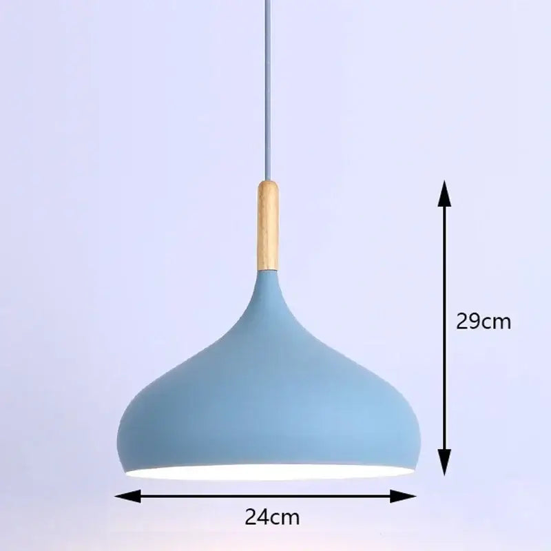 A modern industrial pendant light with a matte blue metal shade and natural wood accent for kitchen use