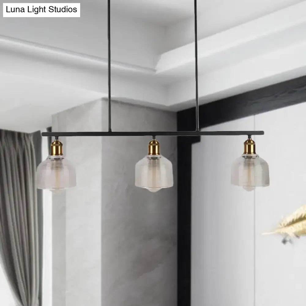 Black metal bar pendant light with three frosted glass shades and brass fixtures suitable for red yellow blue island lighting