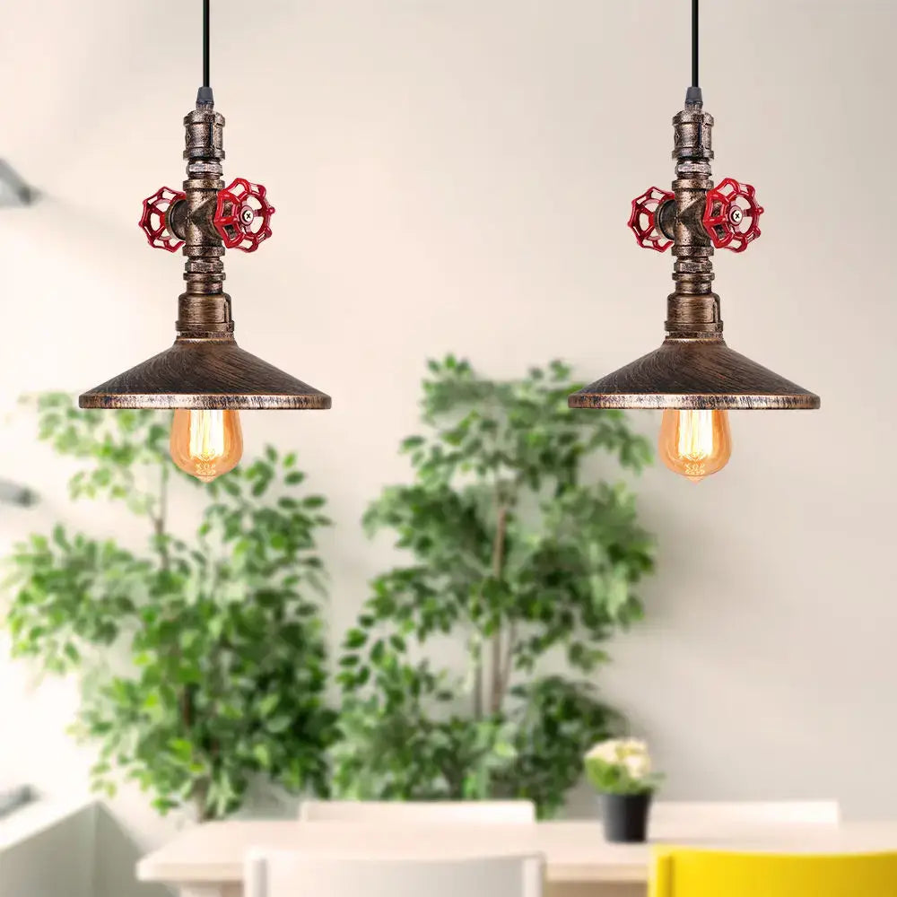 Industrial retro black and bronze pendant light fixture with rusted metal pipes and bright red valve handles for kitchen use