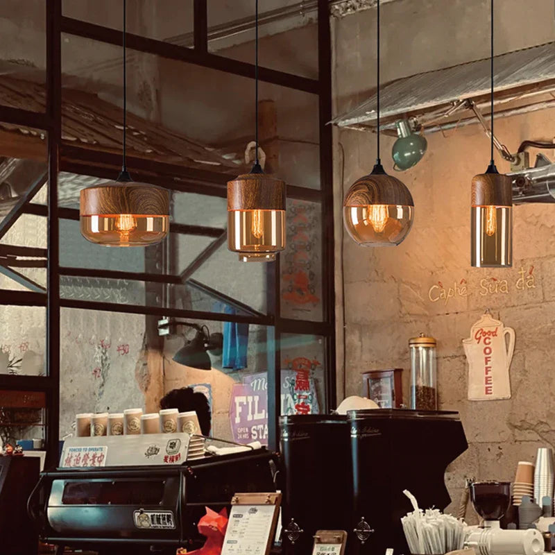 Warm-toned industrial retro led pendant light with wooden tops and glass shades as a dining room light source