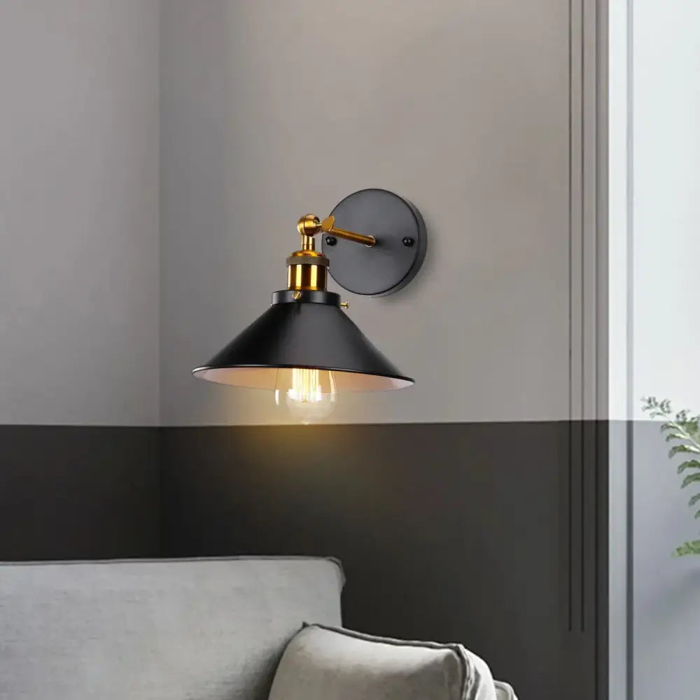 Black metal wall sconce with brass accents and conical shade decorbites industrial retro loft bedroom lighting