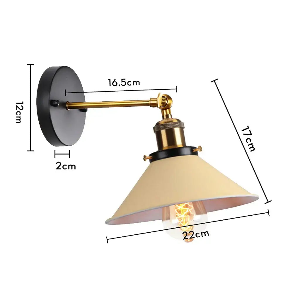 Industrial retro loft wall sconce with black base, brass arm, cream shade, and exposed filament bulb by decorbites