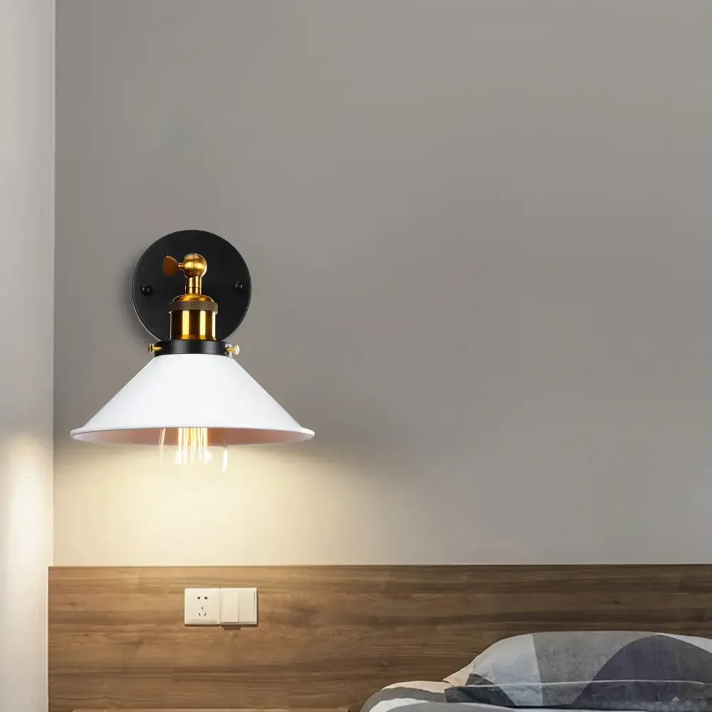 White ceramic wall sconce with brass accents on black wall plate for industrial retro loft bedroom decorbites lighting