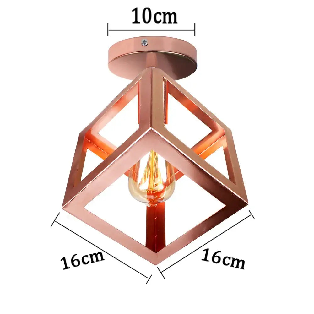 Copper-colored geometric decorbites iron pendant light with visible filament bulb for kitchen and dining room decor