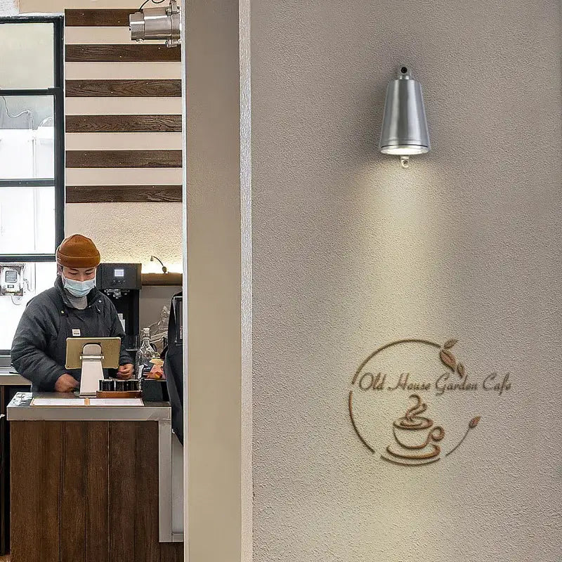 Silver bell-shaped wall lamp featuring decorbites industrial retro spotlight design for courtyard accent lighting